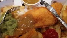 Fish and chips, even more delicious when you add spice, vinegar, tomato ketchup, mushy peas and curry sauce.  Quite heavenly!