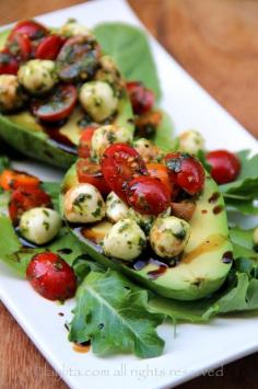 
                    
                        Recipe for caprese stuffed avocado, a delicious appetizer or salad made by filling ripe avocados with tomato and mozzarella caprese salad drizzled with balsamic vinegar reduction.
                    
                