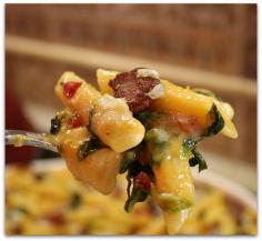 Baked Penne with Spinach, Roasted Peppers and Bacon Yield: 8 to 10 servings Prep Time: 25 min Cook Time: 35 min Ingredients: SAUCE: 16 ounce container of Pacific Natural Foods Roasted Red Pepper & Tomato Soup 2 cups 2% milk 4 Tablespoons butter 1/4 cup all-purpose flour freshly ground pepper, to taste PASTA: 1 pound penne pasta (or ziti), cooked until tender, but still firm to the bite 1 package frozen chopped spinach, thawed & squeezed dry 3/4 cup chopped jarred roasted red peppers 1 1/2 cups cubed Provolone cheese 8 slices of cooked bacon, crumbled 1 1/2 cups shredded Parmesan cheese, divided Freshly ground black pepper kosher salt Directions: 1. Preheat oven to 350 degrees F. Spray 9x13-inch pan (or other 2 1/2-quart baking dish) with nonstick spray. 2. Prepare sauce: Heat soup and milk in a medium saucepan until small bubbles begin to form around the edges (just until hot). In a larger saucepan, melt butter over medium-low heat. Add flour and stir well. Continue to cook, stirring, until thick and smooth, about 2 minutes. Slowly begin adding hot soup/milk mixture to the large saucepan, whisking constantly while adding. Sauce will start out lumpy and become smooth as the liquid is incorporated. 3. Assemble the dish: In a large bowl, toss cooked pasta with the sauce. Break apart the spinach with your fingers and add it to the bowl. Also add red peppers, provolone cheese and 3/4 cup of Parmesan. Stir until ingredients are evenly distributed. Pour the mixture into the prepared dish. Sprinkle with bacon crumbles and top with remaining Parmesan cheese. Finish with a good dose of freshly ground black pepper and a sprinkle of kosher salt. 4. Cover with aluminum foil. Bake 25 minutes. Uncover and bake until sauce is bubbling around the edges and the center is hot (about 10 minutes more). Remove from the oven and let cool for about 10 minutes before serving.