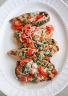 Made this tonight and it was amazing!! Grilled Bruschetta Chicken: 200 calories and only 5 ingredients: 4 small boneless skinless chicken breast halves (1 lb.) 1/4 cup KRAFT Sun Dried Tomato Vinaigrette Dressing, divided 1 tomato, finely chopped 1/2 cup KRAFT Shredded Low-Moisture Part-Skim Mozzarella Cheese 1/4 cup chopped fresh basil
