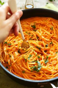 10 ingredient Vegan GF Roasted Red Pepper Pasta! Simple, savory, creamy and healthy! Perfect for a healthier weeknight meal ~ VEGAN ROASTED RED PEPPER PASTA (GF) PRINT PREP TIME 15 mins COOK TIME 45 mins TOTAL TIME 1 hour 10-ingredient roasted red pepper pasta with a creamy, savory-sweet red pepper sauce and fresh parsley. Light, healthy and simple, yet incredibly satisfying. Author: Minimalist Baker Recipe type: Entree Cuisine: Italian, Vegan, Gluten Free Serves: 4 INGREDIENTS PASTA2 red bell peppers2-3 Tbsp olive oil2 shallots, finely chopped4 cloves garlic, finely choppedSea salt and ground black pepper1.5 cups Unsweetened Original Almond Breeze Almond Milk2 Tbsp nutritional yeast1.5 Tbsp cornstarch or arrowroot powder (or other thickener of choice)Pinch red pepper flake (optional, for heat)12 ounces gluten free linguini or spaghetti noodles (or other noodle of choice)FOR SERVINGVegan parmesan cheeseFinely chopped fresh parsley or basil Get $3 Off Probiotic Pearlsª For Digestion INSTRUCTIONS Heat oven to 500 degrees F and roast red peppers on a baking sheet until charred - about 25-30 minutes. Cover in foil for 10 minutes to steam, then remove (peel away) charred skin, seeds and stems. Set aside.Cook pasta according to package instructions; drain, toss in a touch of olive oil, cover with a towel and set aside.While the red peppers are roasting, bring a large skillet over medium heat and sautee onion and garlic in 2-3 Tbsp olive oil until golden brown and soft - about 4-5 minutes. Season with a generous pinch of salt and pepper and stir. Remove from heat and set aside.Transfer sautéed shallot and garlic to blender with roasted peppers, almond milk, red pepper flake, nutritional yeast and cornstarch. Season with desired amount of salt, pepper and red pepper flake.Blend until creamy and smooth, taste and adjust seasonings as needed, adding more salt and pepper or nutritional yeast for flavor. You want the flavor to be pretty robust and strong since the noodles don't have much flavor - so be generous with your seasonings.Once blended, place sauce back in the skillet over medium heat to thicken. Once it reaches a simmer, reduce heat to low and continue simmering.Once sauce is thickened to desired consistency (see photo), add noodles. However, before tossing add a touch more olive oil, salt and pepper to the un-tossed noodles for added flavor. Then, toss to coat.Serve with (generous amounts of) vegan parmesan, red pepper flake and fresh chopped parsley or basil.
