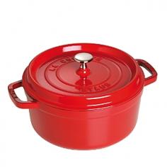 The French oven is a timeless standby for stews, roasts, soups, casseroles and other one-pot classics. Staub has perfected this tradition with their signature La Cocotte French Oven, the choice of some of the worlds best chefs. Staub's traditional round design has self-basting spikes for continuous, natural basting. When your meal is ready, La Cocotte moves beautifully from the stove to your table. Its black matte enamel coatings make it indestructible and highly chip resistant and also keep it from discoloring. The cast iron cookware retains the heat beautifully, keeping the dish warm long after it's been taken out of the oven or off the stove. Staub's attractive appearance make it possible for the dish to go straight from the stove to the table. Features: Made in France and developed in conjunction with France's most celebrated, world renowned chef Paul BocuseTight fitting flat lid features self-basting spikes for continuous, even distribution of juices throughout cooking, so food is moist and flavorful. Smooth bottom is suitable for use on any cooking surface, including induction. Interior black matte enamel finish produces a natural non stick surface that is more resistant to scratches and chips. It won't discolor or rust and never needs seasoning. Oven Safe up to 500FDishwasher safe The Staub journey begins in the Alsace region of France. Rich in history, food and craft, the area is renowned for hearty one-pot recipes and fine enameled ceramics. With as much attention as the Alsatians applied to perfecting the one-pot meal, Staubs founder set himself to perfecting the pot itself. The grandson of a cookware merchant, Francis Staub designed his first enameled pot in an old artillery factory in 1974, merging cast irons utility with the latest technology available. Today the success of these designs has become the benchmark for enameled cast iron cookware and is the reference brand for some of the worlds great chefs including Paul Bocuse. The winning result is French enam