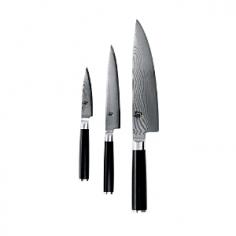 A generous gift for an avid cook, this Shun Classic 3-piece set is perfect for both novices and seasoned gourmets. Youâ ll find the core knives every kitchen needsâ 3½" paring, 6" utility, and 8" chefâ sâ presented in a beautiful storage box. Shun Classicâ s tasteful and contemporary design features beautiful Damascus-clad blades and D-shaped ebony pakkawood handles. Behind each knifeâ s beauty is function: a razor-sharp blade offering precision performance. Shun Classic knives feature a core of proprietary VG-MAX super steel clad on both sides with 34 layers of Damascus stainless steel. The woodgrain pattern of the steel allows the blade to slide easily through food. The result is a knife thatâ s sharp, durable and corrosion resistant, as well as beautiful to behold. NSF-certified knives meets the high-level safety standards for professional kitchens. CLASSIC 3-PIECE SET INCLUDES: 3½" PARING KNIFEIdeal for peeling, coring, trimming, decorating, and other detail work. Generally, youâ ll use this knife in your hand rather than against a cutting board, though paring knives can also be used for chopping small foods, such as garlic cloves. 6" UTILITY KNIFEGreat for a multitude of small tasks where more precise cuts are needed, such as trimming broccoli, green beans, or other smaller vegetables. The utility knife is sometimes called a sandwich knife because it works well on almost everything that goes into a sandwichâ from thin-skinned vegetables such as tomatoes, to meats and cheeses. 8" CHEFâ S KNIFEThis powerful kitchen multi-tasker is perfect for slicing, dicing, and chopping large quantities of fruits, vegetables, meats, and more. The wide blade keeps knuckles off the cutting board and is extra handy when transferring cut food from board to pan. Manufacturer: KAI USA Ltd. Includes: 3½" paring knife, 6" utility knife, 8" chefâ s knife, and presentation/storage box Material: Stainless steel blade, pakkawood handle Care: Hand wash only Warranty: Limited lifetime warranty Handcrafted in Seki City, JapanFree sharpening on all Shun cutlery for as long as you own it.