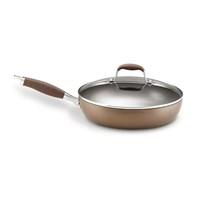 Ultra-durable hard-anodized construction for quick, even heating Twice as hard as stainless steel Restaurant-tested by professional chefs Du Pont Autograph 2 nonstick coated interior, bronze coated exterior Superior nonstick coating offers easy food release and cleanup Safe for use with metal utensils Easy-to-grip Anolon SureGrip handles are stainless steel and silicone Break-resistant glass lid maintains heat and moisture, allows for easy monitoring Dual-riveted and oven-safe to 400 degrees F/206 degrees CNot induction-safe; not dishwasher safe - hand-washing recommended Lifetime limited warranty12-in. skillet includes lid. Convenience while cooking and cleaning up is served up with the Anolon Bronze Nonstick 12 in. Covered Deep Skillet. With a hard-anodized construction that's twice as hard as stainless steel, this durable skillet is your go-to pan for sautéing veggies, flipping pancakes, cooking omelets, and searing steaks, fish, and poultry. The sloped sides are especially helpful for successfully transferring delicate foods, such as pancakes and omelets, from pan to plate. Dupont Autograph 2 nonstick coating on the interior provides excellent food release and quick, easy cleanup. The convenient break-resistant glass lid maintains heat and moisture and makes it easier to monitor what you're cooking. Hand-washing is recommended, as this skillet is not dishwasher-safe; also, not safe for use on induction cooktops. About Anolon CookwareFor those who think recipes are more like suggestions, meet Anolon - a leading brand of gourmet cookware designed to empower food enthusiasts to creatively express themselves in the kitchen. Anolon gives home cooks the ability to cook outside the recipe by offering a wide selection of high-performance, exceptionally crafted cookware, bakeware, cutlery, tools and gadgets that satisfy the needs of each home chef's unique cooking style. Celebrate creativity in the kitchen with Anolon.