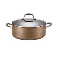 Create a batch of bison-chipotle chili or boil enough spinach fettuccine for a Tuscan family feast in the Anolon Advanced Bronze Hard-Anodized Nonstick 7.5-Quart Covered Wide Stockpot. Extra wide to do the job with ease, the wide stockpot's heavy-duty, hard-anodized construction provides efficient, even heat distribution to help reduce hot spots that can burn foods. The stockpot boasts a lustrous bronze nonstick exterior coupled with a deep chocolate interior and a gently flared tulip-shaped profile. Restaurant tested by professional chefs, the Autograph 2 nonstick surface inside delivers superior durability to stand up to the rigors of a professional kitchen, is ideal for easy cleanup, and is metal utensil safe. Revolutionary Anolon SureGrip handles feature comfortable rubber over durable stainless steel for a confident grip and are dual riveted for added strength. And the shatter-resistant glass lid allows easy monitoring of food while it cooks without losing heat or moisture. Oven safe to 400-degrees F, this wide stockpot coordinates well with many other pieces in the Anolon Advanced collections. Construction: Single layer Surface: Non-stick Materials: Hard anodized aluminum Lid material: Glass Handle attachment: Riveted Care instructions: Hand wash Finish: Non-stick Dimensions: 7.5 quart Oven safe to: 400-degrees F Heavy-duty hard-anodized construction provides efficient, even heat distribution to help reduce hot spots that can burn foods. Stockpot boasts a warm bronze nonstick exterior coupled with a deep chocolate interior and a gently flared tulip-shaped profile. PFOA-free restaurant-quality DuPont Autograph 2 nonstick inside and out is long lasting and metal utensil safe, and makes cleaning up effortless.