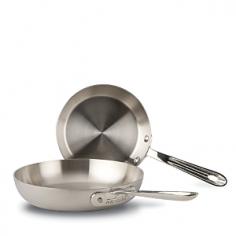 Perfect for everything from frying eggs and bacon to searing a salmon fillet, these versatile stainless steel skillets are a welcome addition to any kitchen. A revolution in cookware technology, d5 cookware is the most advanced collection to bear the legendary All-Clad name. Featuring five-layer construction with a patented stainless-steel core for unmatched heat stability and exceptional heating performance, All-Clad d5 virtually eliminates hot spots for precise control while cooking. All-Clad d5 is optimized for induction cooking and features chef-friendly features such as ergonomic handles that offer precise control. Developed over years of extensive testing and refinement, d5 cookware delivers the results that professional chefs demand, yet is forgiving enough for even novice cooks. Set includes one 7" skillet and one 9" skillet. Manufacturer: All-CladIncludes: 7" skillet, 9" skillet Material: Aluminum, stainless steel Care: Dishwasher safe Use: Oven safe to 500°FDimensions: 7" diameter; 9" diameter Warranty: Lifetime warranty Made in USAFEATURESFive-layer bonded construction with a unique, patented stainless-steel core maximizes the thermal conductivity of the two aluminum layers, providing 20% more even heating than traditional bonded cookware, eliminating hot spots and improving temperature stability Thanks to its innovative construction that features a magnetic 18/10 stainless steel exterior followed by a layer of aluminum, a ground-breaking stainless-steel core, another layer of aluminum and an 18/10 stainless steel interior, d5 is optimized for induction cooking and compatible with all other cooktops True 5-ply bonded construction, from the base right up to the rim for optimal cooking performance across the entire surface of the pan Dishwasher-safe pan will not react with cooking foods Ergonomic, oversized handle provides exceptional comfort and control and is attached with stainless steel rivets for incredible durability Each pan underside is etched with its size, making it easy to select the right pan for the job