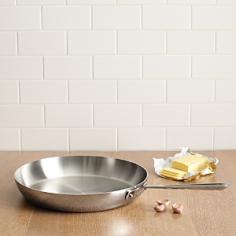 Sear, brown, and pan fry a wide range of foods with the All-Clad Stainless Steel 7-Inch French Skillet. With its large surface area and round sides, this skillet can hold in heat and prevent liquids from splattering. Its sloped sides make it easy to toss food or turn it with a spatula. The stick-resistant stainless steel construction allows for even heating and excellent performance. Ideal for Searing, Browning, and Pan Frying The large surface area and round sides of the French skillet help hold in heat and liquids while preventing splattering, making the pan ideal for searing, browning, and pan frying a variety of foods. The round sides make it easy to toss food for even cooking. Premium Stainless Steel Construction Classic design, high performance, and lifetime durability unite in the Stainless Collection, All-Clad's most popular line of cookware. Products in the collection feature an interior core of aluminum for even heating and a high-polished, 18/10 stainless steel exterior and cooking surface for fine culinary performance. All-Clad stainless steel cookware features an interior starburst finish for excellent stick resistance. The bottom of each pan is engraved with a convenient capacity marking. What's in the Box 7-inch stainless steel French skillet and warranty information.