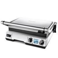 The Breville Smart Grill brings the delicious taste of barbequed foods indoors. It offers various temperature settings that are great for making Panini sandwiches and for searing meats and other foods. The grill also comes with a low setting that's good for reheating leftovers. The Smart Grill has intelligent programming, where sensors can detect the need to raise or lower temperatures on the cooking surface. It also can open and lay flat, providing the user with an open BBQ grill. While the ribbed surface works well with meat, a flatter surface is also included, making the appliance great for cooking eggs, pancakes, and other breakfast items. As an added convenience, the provided drip tray minimizes messes. This Breville Grill comes apart for easy cleaning, and some of the parts can be safely run through a dishwasher.