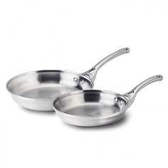 Cookware Sets - With a full aluminum core, the fast-heating Calphalon Tri-Ply Stainless Steel Omelette Pans pair reliable durability with lustrous styling. Omelettes are simply the beginning for the Calphalon omelette pan set that fries, sears, sautes and poaches in no time. Layered between a brushed stainless steel exterior and interior, the heavy-gauge aluminum core ensures consistent, even heating extending up the sides of the stainless omelette pans. Brushed, magnetic exteriors are fully induction ready and the durable brushed interior ensures optimum browning and efficiently cooks everything from eggs, pancakes and crepes to stir fry, soft-shell crabs and caramelized onions. Calphalon rolled stainless steel handles stay cool and the flared rims make it easy to pour ingredients. Designed for all cooktops, the Calphalon tri-ply stainless steel omelette pans are conveniently safe for oven, broiler and dishwasher. PFOA-and PTFE-free. Since the 1960s, Calphalon has equipped professional and home chefs - Specifications Material: heavy-gauge aluminum core; brushed stainless steel interior and exterior; cast brushed stainless steel handle Model: 1763467 Made in China 8" Omelette Pan 10" Omelette Pan Care and Use Before using your Calphalon tri-ply stainless steel omelette pans for the first time, wash in warm, sudsy water and dry thoroughly. The Calphalon omelette pan set is dishwasher safe, but hand washing helps protect the cookware's finish. Allow the Calphalon omelette pans to cool completely before washing. Never immerse a hot pan in cold water, as this may cause warping. To wash by hand, simply clean with a liquid dishwashing detergent and a nonabrasive sponge or soft bristle brush. Maintain the finish with Bar Keeper's Friend cleanser and a nonabrasive sponge. Do not use abrasive cleaners or cleaning pads, oven cleaners or other caustic cleaning solutions, baking soda, bleach, or liquid household cleaners used for floors, porcelain, etc. to clean the pa
