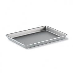 Baking & Cookie Sheets - Up to twice as efficient as Calphalon Classic Bakeware in releasing foods, the Calphalon Nonstick Bakeware Brownie Pan features advanced interlocking nonstick layers. With the innovative nonstick baking surface, your mouth-watering peanut butter brownies and date bars bake beautifully and glide right from the pan. The Calphalon nonstick brownie pan is engineered of a heavy-gauge steel core that ensures even heating throughout the durable bakeware. A thick rolled rim helps prevent warping or bending and makes for easy-grip transport of the shallow 9" x 13" cake pan. Even the stickiest of foods including your breakfast frittata and jalapeno corn bread come instantly clean from the nonstick brownie pan so dishwasher cleanup is a breeze. Oven safe to 500 F with full lifetime warranty. Calphalon finds its roots in the early 1960s in a suburb of Toledo, Ohio. By 1968 the commercial cookware firm adapted a NASA technology and named its new hard-anodized aluminum cookware and the co - Specifications Material: interlocking nonstick layers, heavy-gauge steel core Model: 1826053 Size: 9 1/2"W x 13"L x 1 1/4"H Weight: 1 lb. 4 oz. Made in the China Care and Use Before using your Calphalon nonstick brownie pan for the first time, hand wash in hot, sudsy water and dry thoroughly. Do not use aerosol cooking sprays. Sprays are difficult to remove and can build up on nonstick surfaces and lessen food release effectiveness. Calphalon Nonstick Bakeware is oven safe to 500 F. Never place the shallow 9" x 13" cake pan in the broiler or freezer. To preserve your Calphalon nonstick brownie pan's finish, use nylon, coated or wooden utensils only. Do not use knives, forks or metal utensils of any kind. Always allow the shallow 9" x 13" cake pan to cool completely before washing. Never immerse hot bakeware in cold water; doing so can cause irreparable warping. The nonstick brownie pan is dishwasher safe, but hand washing