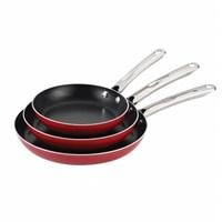 This triple pack of skillets with gorgeous stainless steel handles pair style and durability at a price home cooks can afford. The pans are perfect for preparing a dinner of shrimp Creole, or potatoes and sausage for breakfast. Choose from three skillet sizes, depending on the recipe and the number of people being served. This versatile Farberware skillet displays the quality and value that have been hallmarks of the company for over 100 years. The skillets feature heavy gauge construction that distributes heat evenly and reduces hot spots. The pans are durable enough for everyday use, and the nonstick interiors offer easy food release and cleanup. With a sleek, colorful exterior, each skillet fits in well with any kitchen dà cor. The handles are comfortable to use, double riveted for strength and oven safe to 350°F. These pans are also dishwasher safe for convenience. Color: Red.