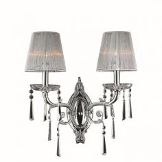 This stunning 2-light Crystal Wall Sconce only uses the best quality material and workmanship ensuring a beautiful heirloom quality piece. Featuring a radiant chrome finish, beautiful curved arms with white sheer nylon shades which support two candelabra lights and all over crystal embellishments made of finely cut premium grade 30% full lead crystal, this chandelier will give any room sparkle and glamour. Worldwide Lighting Corporation is a privately owned manufacturer of high quality crystal chandeliers, pendants, surface mounts, sconces and custom decorative lighting products for the residential, hospitality and commercial building markets. Our high quality crystals meet all standards of perfection, possessing lead oxide of 30% that is above industry standards and can be seen in prestigious homes, hotels, restaurants, casinos, and churches across the country. Our mission is to enhance your lighting needs with exceptional quality fixtures at a reasonable price. Finish: Polished Chrome Crystal Color: Clear 30% Premium Full Lead Crystal (2) 60W E12 Incandescent Candelabra Bulb(s) Bulb(s) Not Included Total Watts: 120 Voltage: 110V - 120V Beautiful Polished Chrome finish and dressed with precision cut and polished 30% Full Lead Crystals for maximum brilliance and sparkle From the Orleans Collection Accommodates up to two 60-watt maximum (40-watt recommended) candelabra base incandescent E-12 bulb (not included) Solid Brass Frame in Chrome Plated Finish, 30% Full Lead Crystal and White String Shade Wall mount with 9" extension from wall UL and CUL Listed to US and Canadian safety standards For Dry Locations only (Dry Locations include kitchens, living rooms, dining rooms, bedrooms, foyers, hallways and most areas in bathrooms) Hardware included Assembly instructions and template enclosed for convenient setup (Professional installation is recommended) 1 Year Limited Manufacturing Defects Warranty Hardwired UL Listed, cUL Listed, CSA Listed Style: Traditional Part of the Orleans Collection Warranty Info: 1 Year, Worldwide Lighting Corporation warranties products to be free from defects for a period of one year following shipment. Warranty is and void if merchandise is not installed according to factory instructions, NEC guidelines, and applicable building cOverall Dimensions: 9"(D) x 15"(W) x 9"(H)Diameter Range: Width from 15" to 20"Item Weight: 6 lbs. Please note that this product is designed for use in the United States only (110 volt wiring), and may not work properly outside of the United States*Use of this product will expose you to lead, a chemical known to the State of California to cause birth defects or other reproductive harm. Not intended for food use.