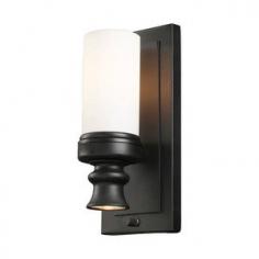 Modern and sophisticated lighting design. 2 lights; top and bottom lighting. Oiled bronze finish with opal etched blown glass shade. Requires 1 candelabra base 60-watt bulb (not included). Requires a single 20-watt mr16 bulb (not included). Overall dimensions: 5W x 5D x 12H inches. About E.L.K. LightingIn 1983, Adolf Ebenstein, Jonathan Lesko, and Russell King combined their lighting expertise to form E.L.K. Lighting Inc. From the company's beginning in eastern Pennsylvania, it has become a worldwide leader featuring manufacturing facilities and showrooms in the U.S. and abroad. Award-winning designs and state-of-the-art engineering give their lighting and home decor items outstanding quality and value and has made E.L.K. the choice of such renowned places as the Historic Royal Palaces of England and George Vanderbilt's Biltmore Estates. Whether a unique custom design or one of their designer lines, all products are supported by highly trained technical and customer service teams. A commitment to providing superior lighting and home products with unmatched customer satisfaction remains at the heart of the E.L.K. family tradition. Please note this product does not ship to Pennsylvania.