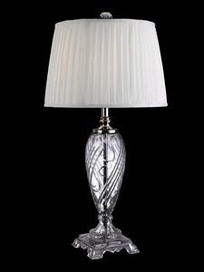 Constructed of metal and crystal. Table lamp in traditional style. High-quality fabric shade. Requires (1) 150-watt E27 bulb (not included). Dimensions: 15L x 15-watt x 30.5H inches. The body of the Dale Tiffany Holland Table Lamp is made from beautiful cut crystal, with a metal pole in the center for durability. An elegant addition to any home's decor, this lamp features a pleated fabric shade, and uses one 150-watt E27 bulb (not included).About Dale TiffanyFounded in 1979, Dale Tiffany, Inc. started manufacturing Tiffany-styled lamps and shades, emphasizing high-quality reproductions of Louis Comfort Tiffany's famous designs. Today, using only the highest quality genuine hand-rolled art glass, Dale Tiffany offers an extensive range of designs to comprise the world's foremost collection of fine art glass lighting and home accents. With this hand-crafted process, no two pieces are exactly alike, making each design a treasured keepsake. Dale Tiffany captures the timelessness of America's classic designers while developing unique designs that blend perfectly with today's home fashion trends and lifestyles.