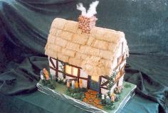 For her gingerbread cottage, Britta M. Peterson of San Jose, California, simulated a thatched roof, smoking chimney, and a warmly lit interi...